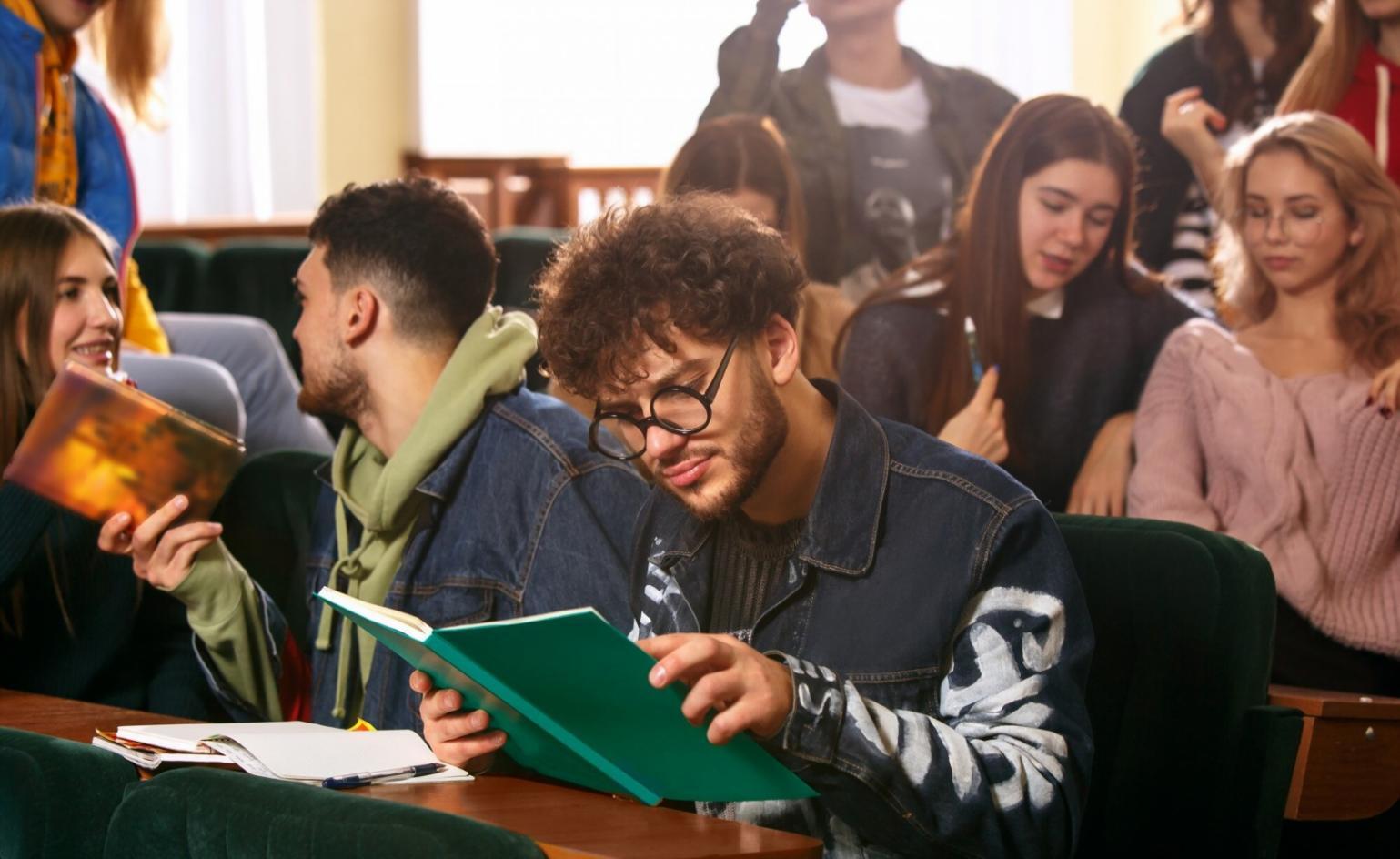 Team workspace with budget planning documents and laptops